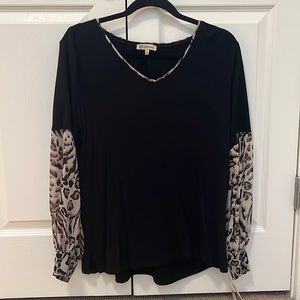 Black jersey shirt with animal print sleeves